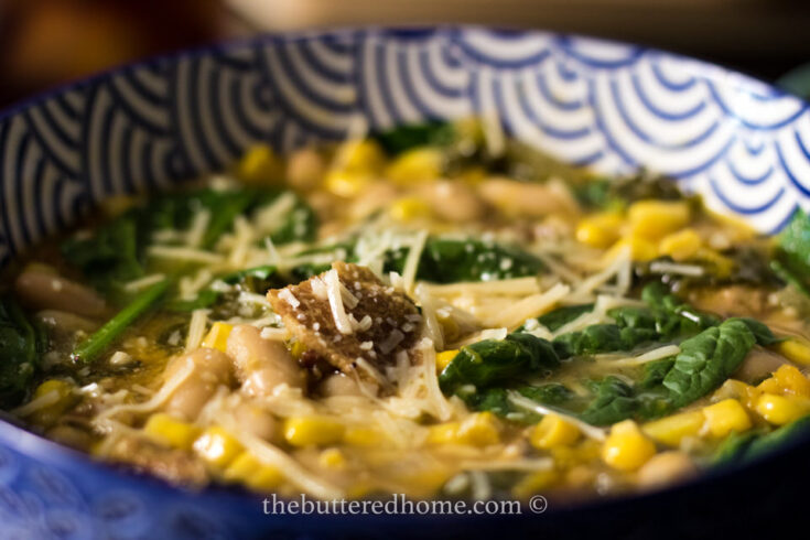 butternut squash soup in a blue lined bowl