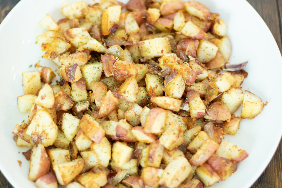 cooked potatoes in a white bowl