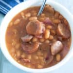 baked beans in a white bowl. Feature