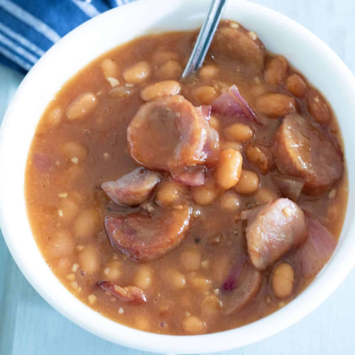 baked beans in a white bowl. Feature