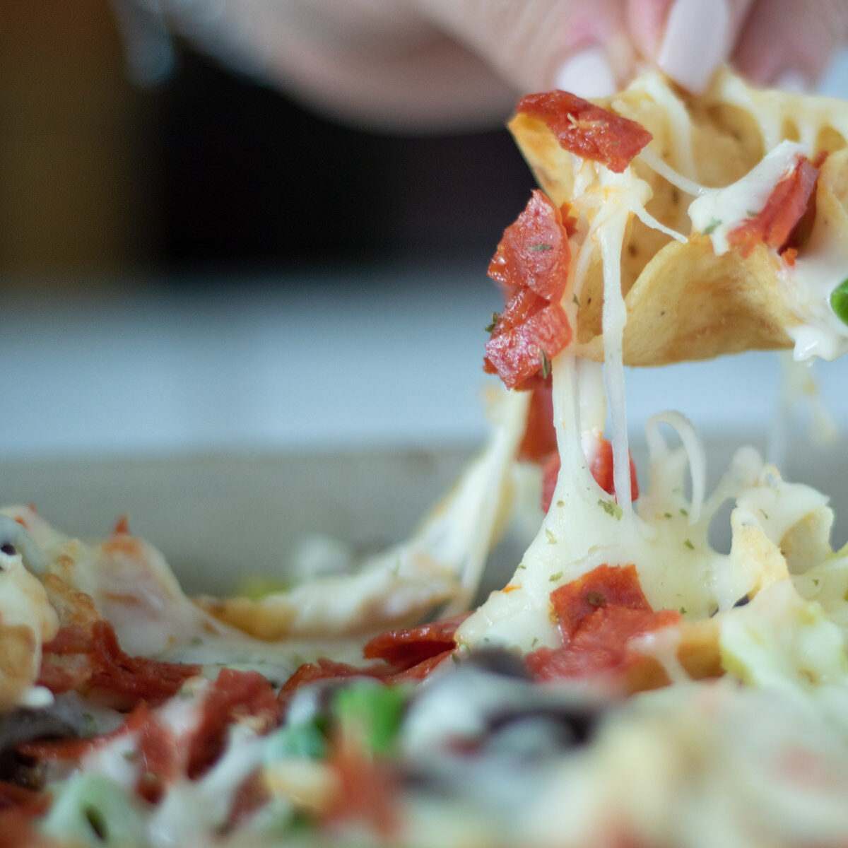 Italian nachos with cheese pull