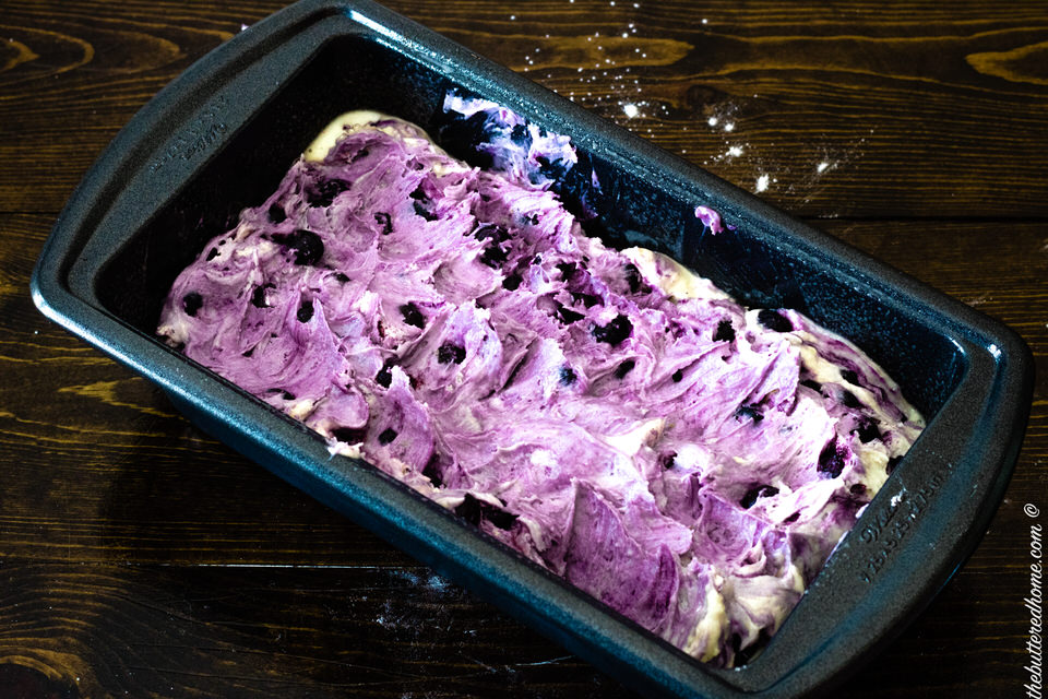 blueberry cake uncooked in baking pan
