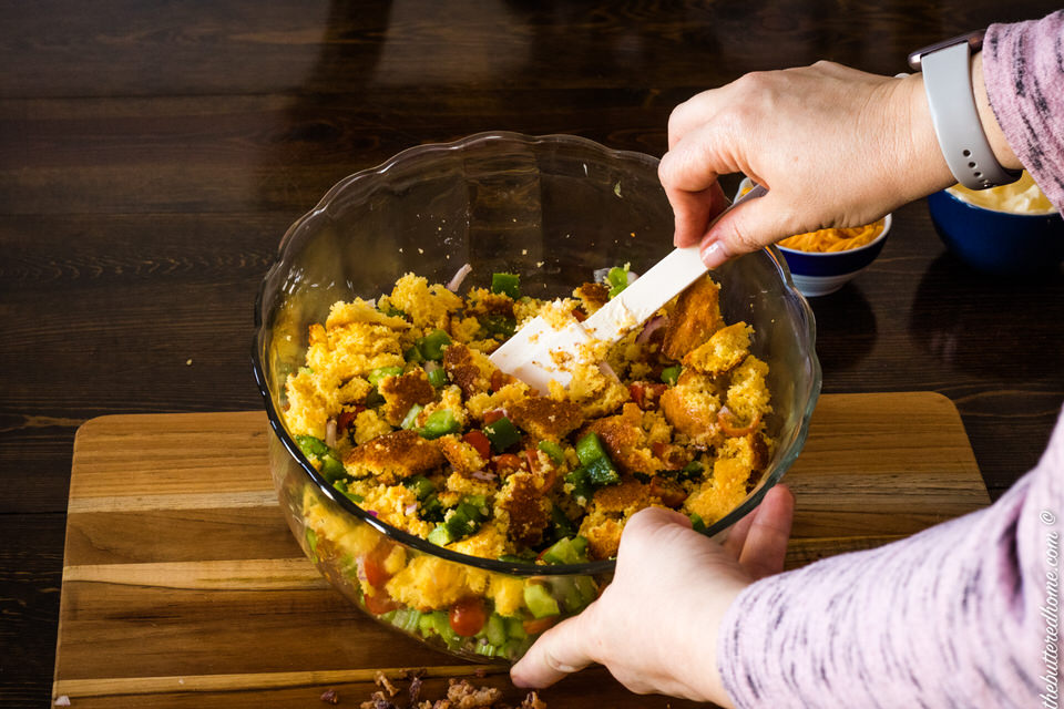 mixing cornbread salad