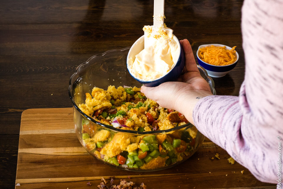 adding mayo to bacon cornbread salad