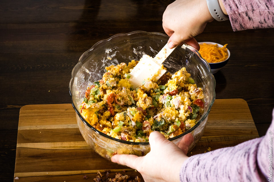 mixing bacon cornbread salad