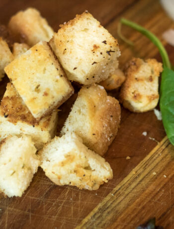 homemade croutons for salad on a cutting board
