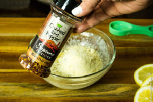 adding the red pepper flakes in the topping mixture