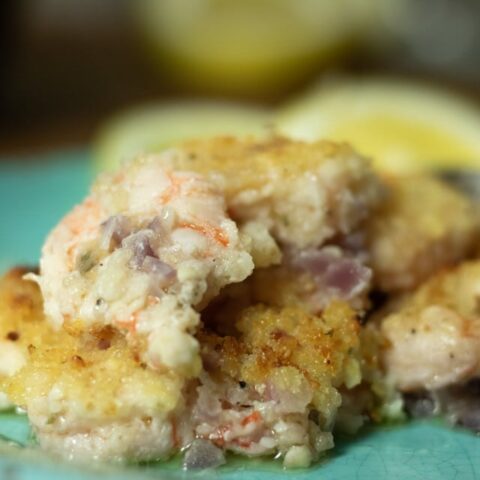 close up of crunchy baked shrimp on blue plate