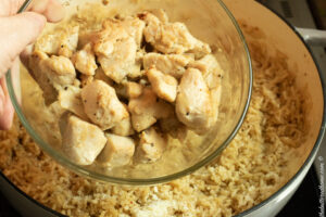adding cooked chicken back in with rice