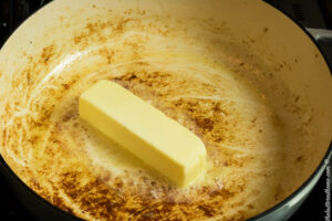 melting one stick of butter to make a sauce