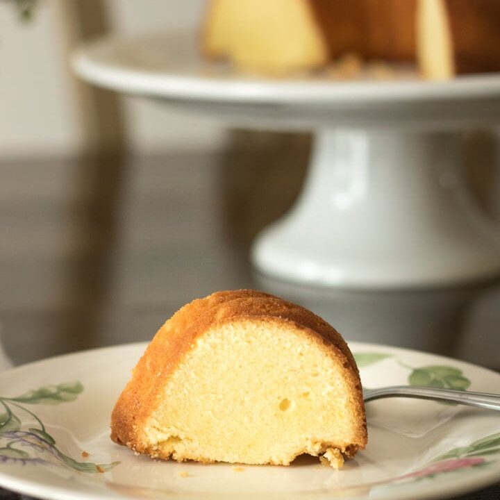 a slice of buttermilk pound cake on a floral plate