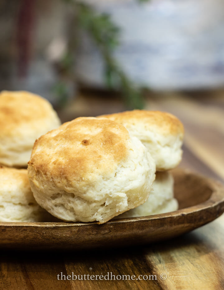 homemade biscuits on a wooden platter