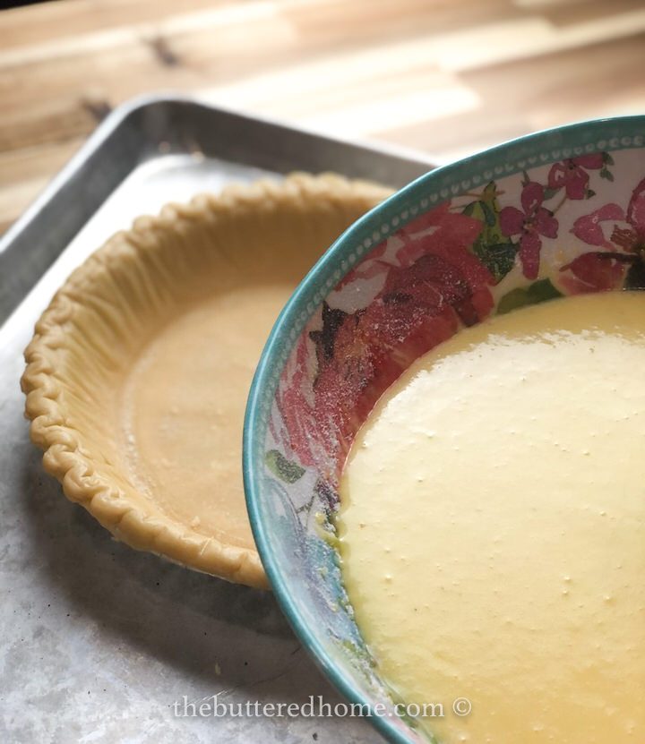 pouring batter into pie crust