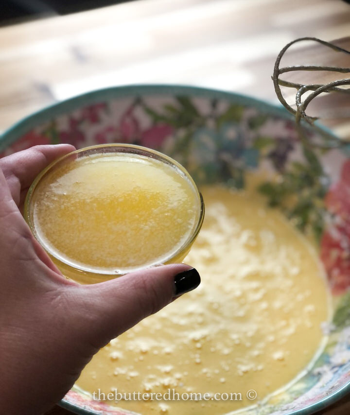 adding melted butter to egg mixture