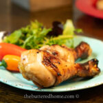 chicken legs bbq on a blue plate