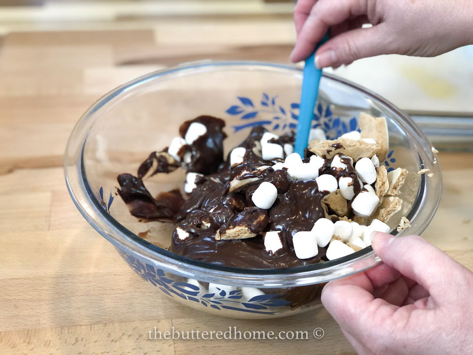 mixing chocolate with cookies and marshmallows