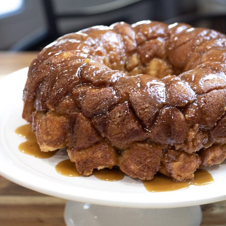 monkey bread with caramel sauce on cake plate