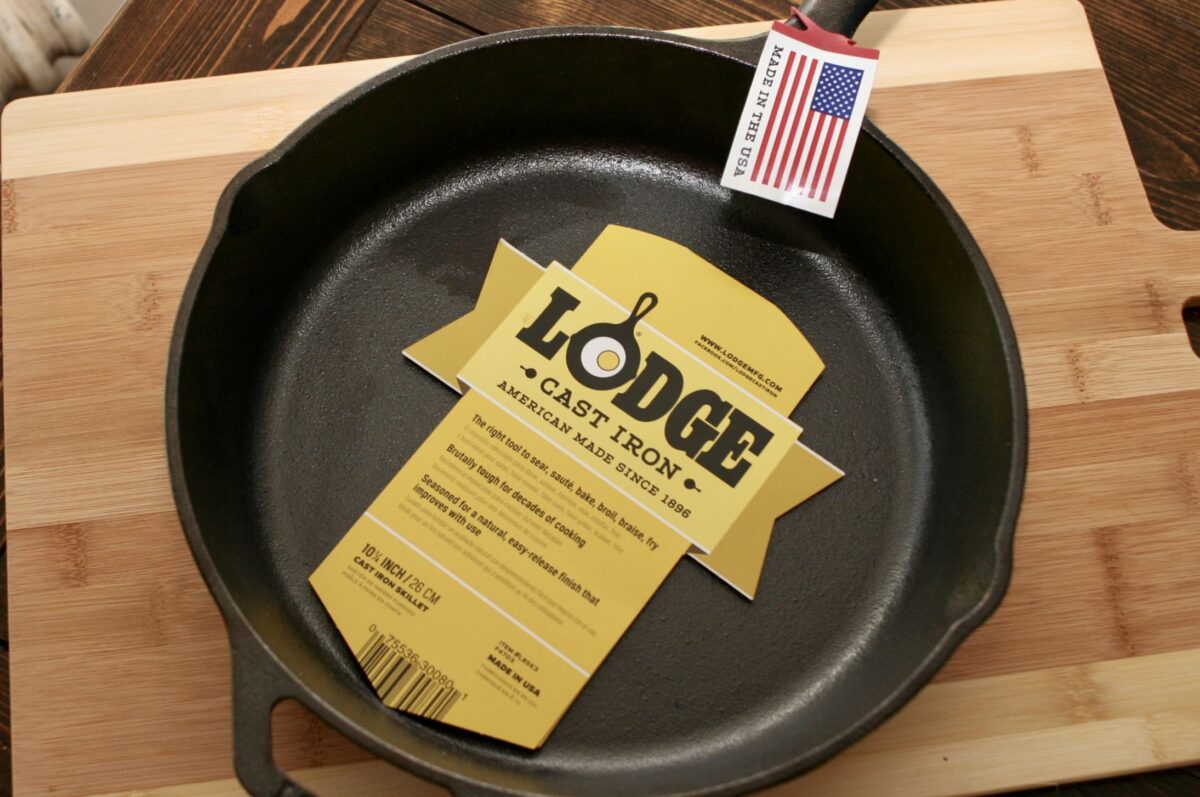 A new Lodge cast iron skillet with a tags displayed in the pan.