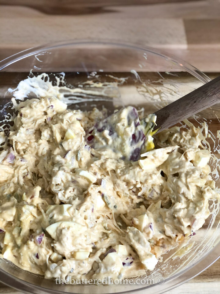 mixing dill chicken salad