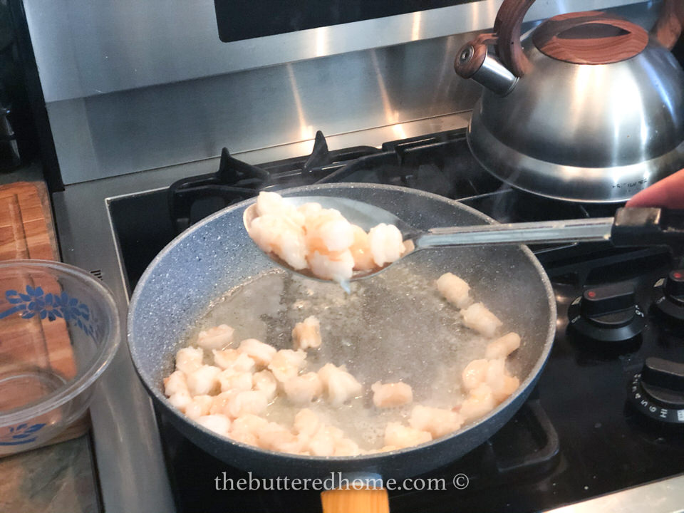 removing shrimp from pan