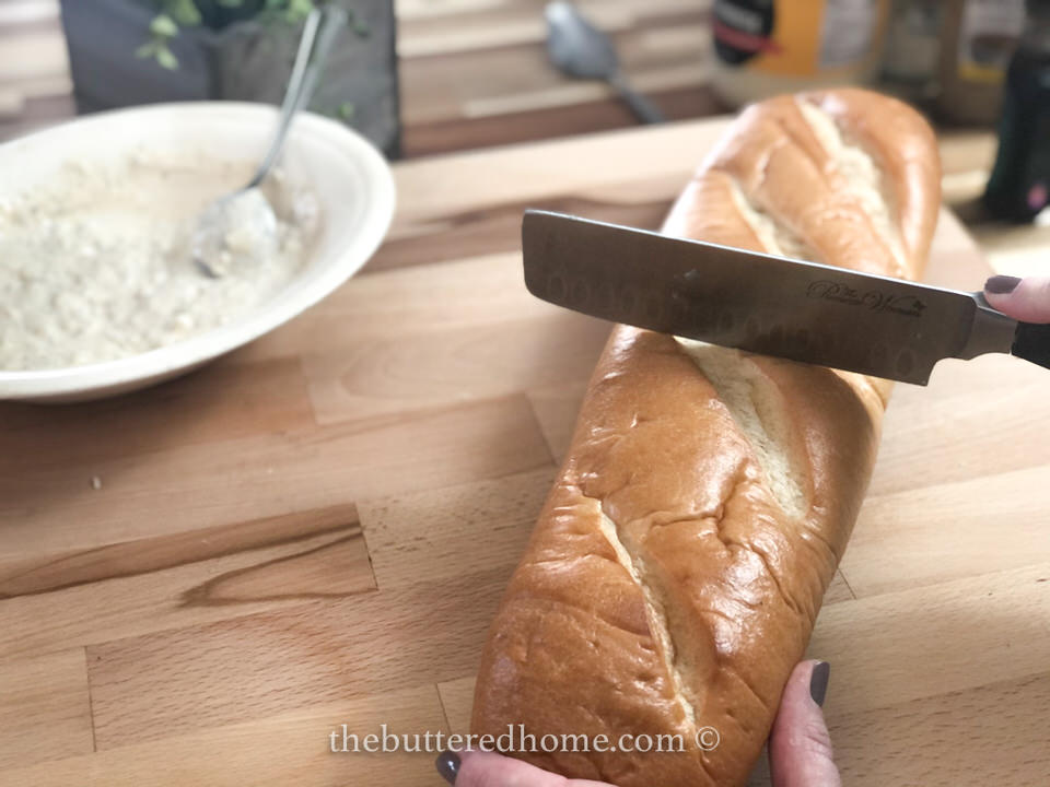 cutting French bread