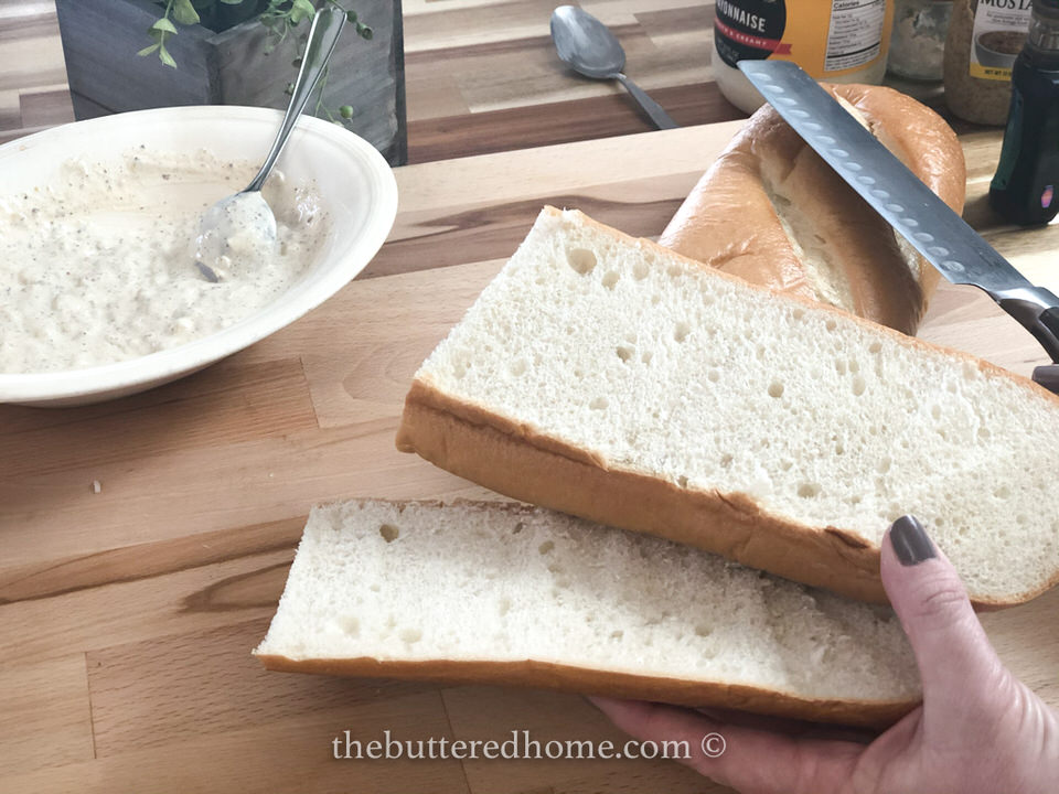 slicing French bread