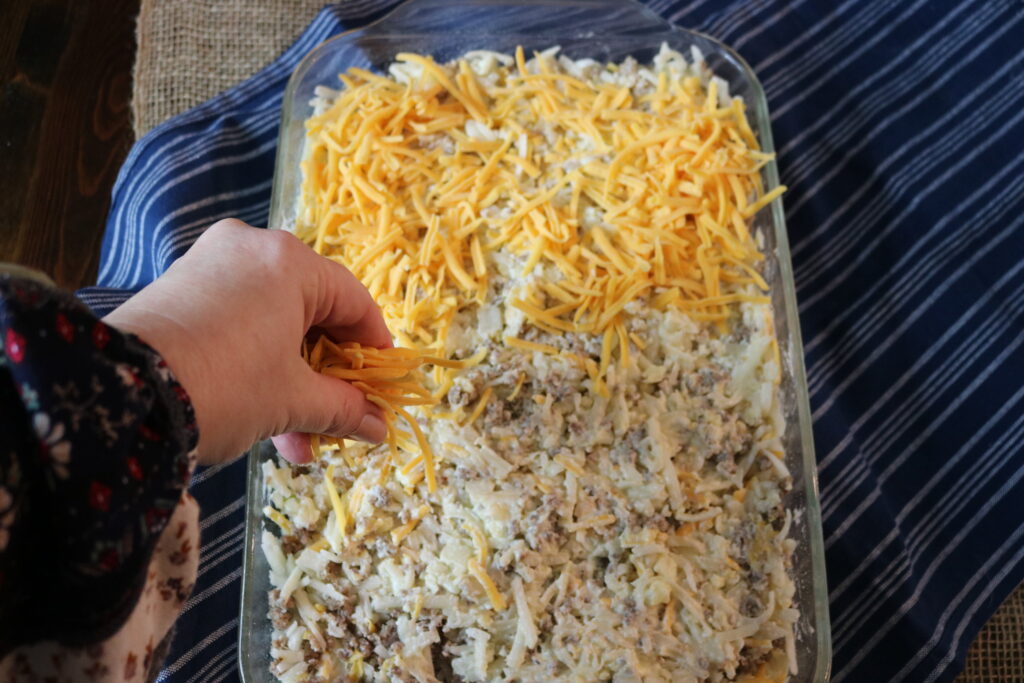topping hashbrown casserole with cheddar cheese