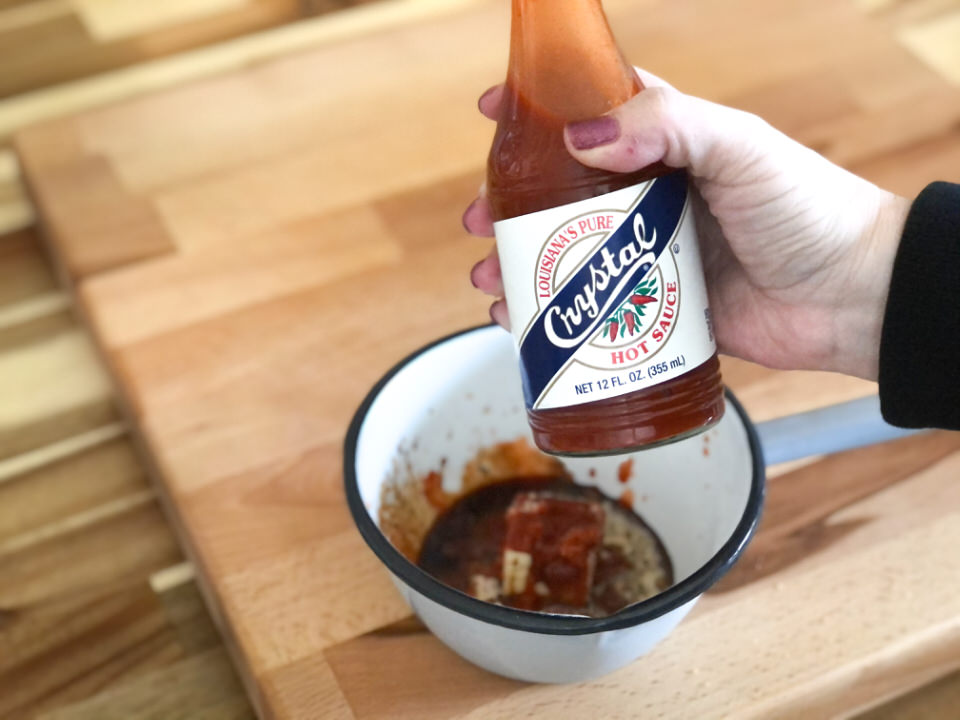 adding hot sauce to wing sauce