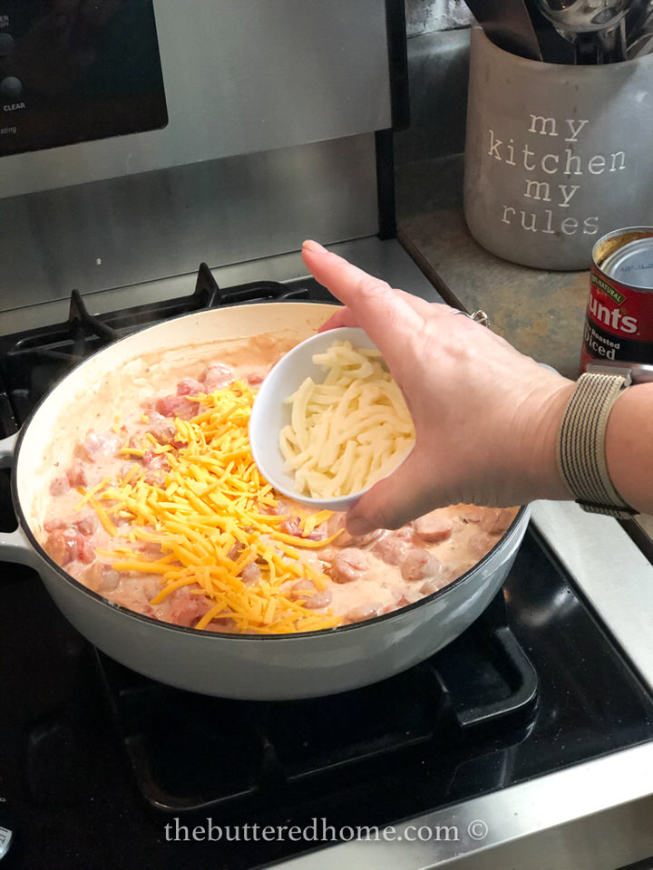 Adding mozzarella cheese.
