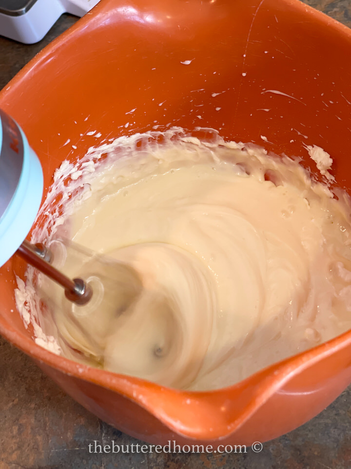 blending milk with cream cheese