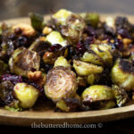 close up of roasted Brussels on a brown plate