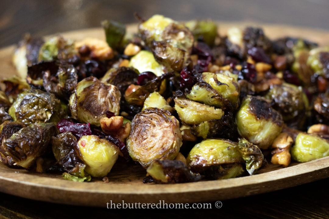 close up of roasted Brussels on a brown plate