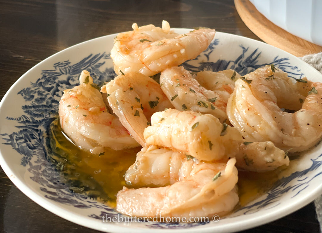 cooked shrimp in a blue and white bowl