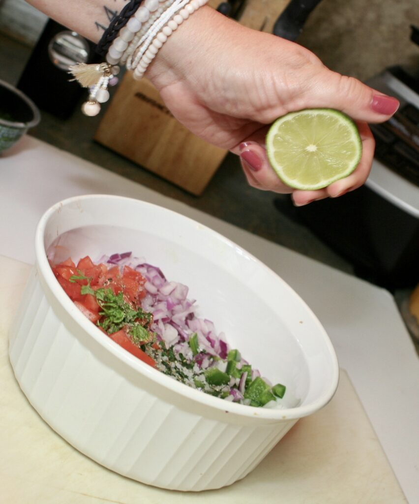 squeezing lime over pico