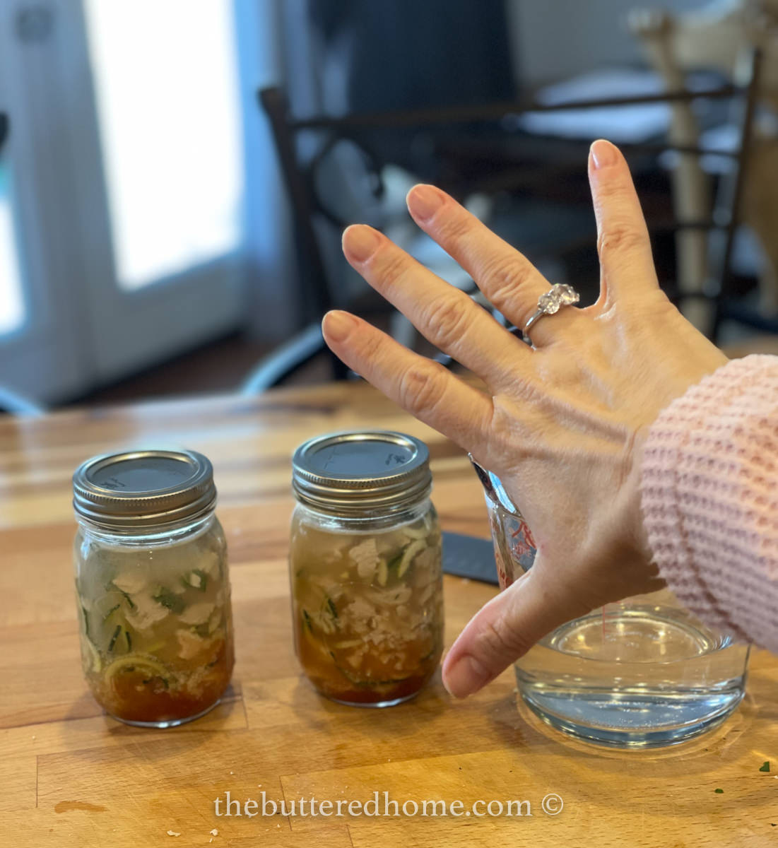 two jars of soup with hand showing 5 ingredients