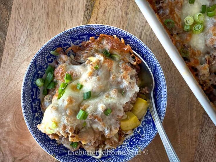 taco casserole with green onions and cheese