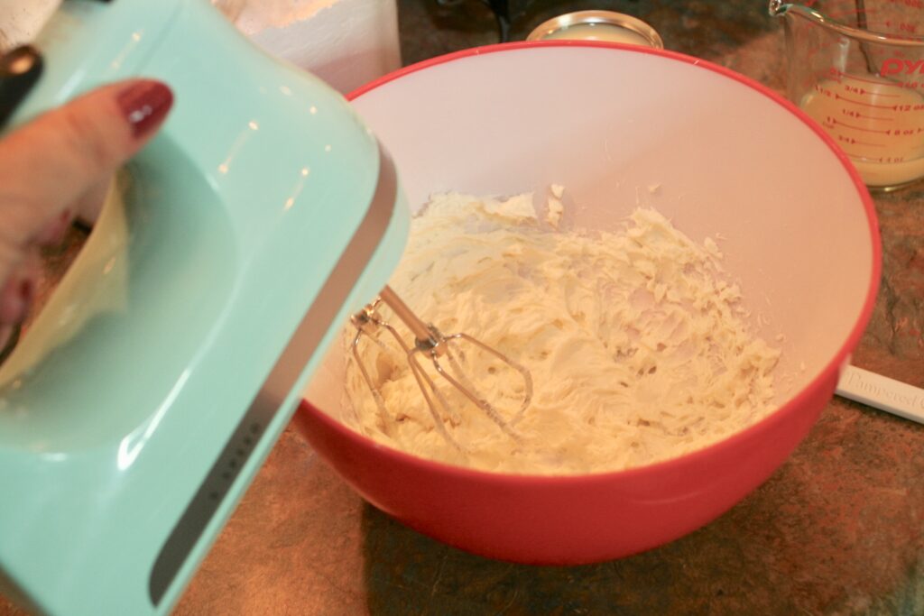mixing cream cheese until fluffy