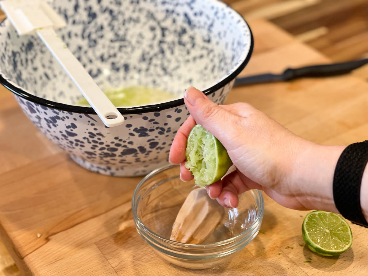 squeezing a fresh lime for juice for pie