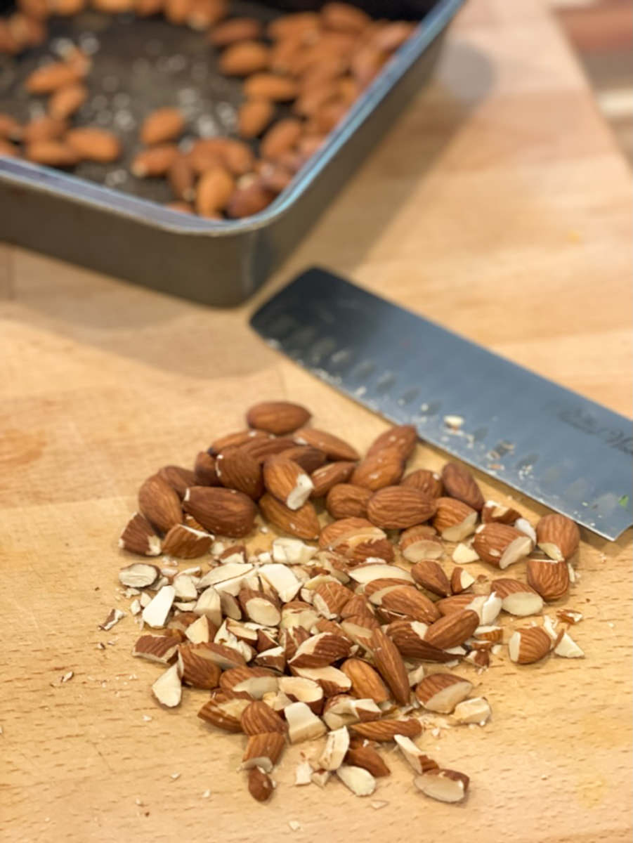 chopping roasted almonds
