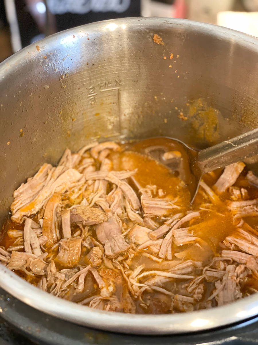 stirring in the shredded pork loin to pan juices