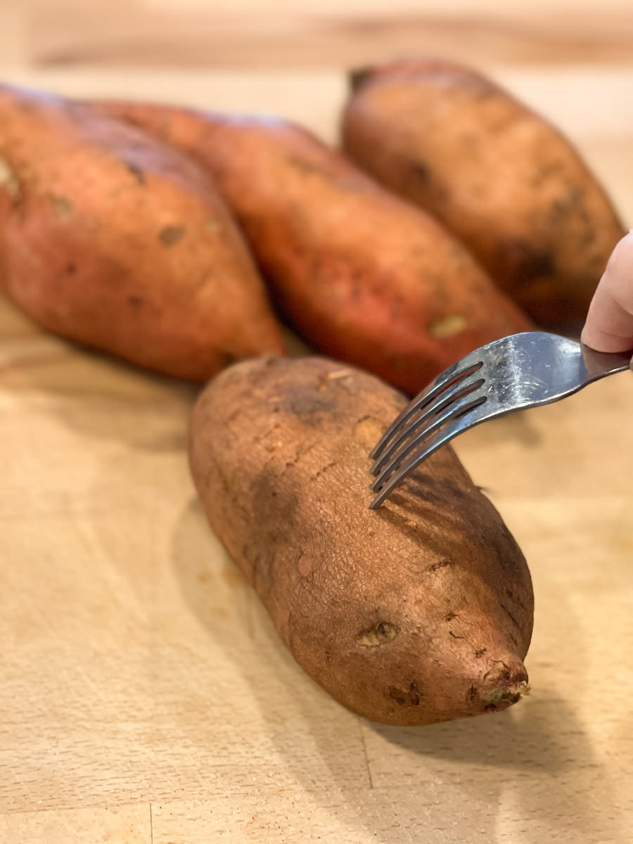poking holes in uncooked sweet potatoes