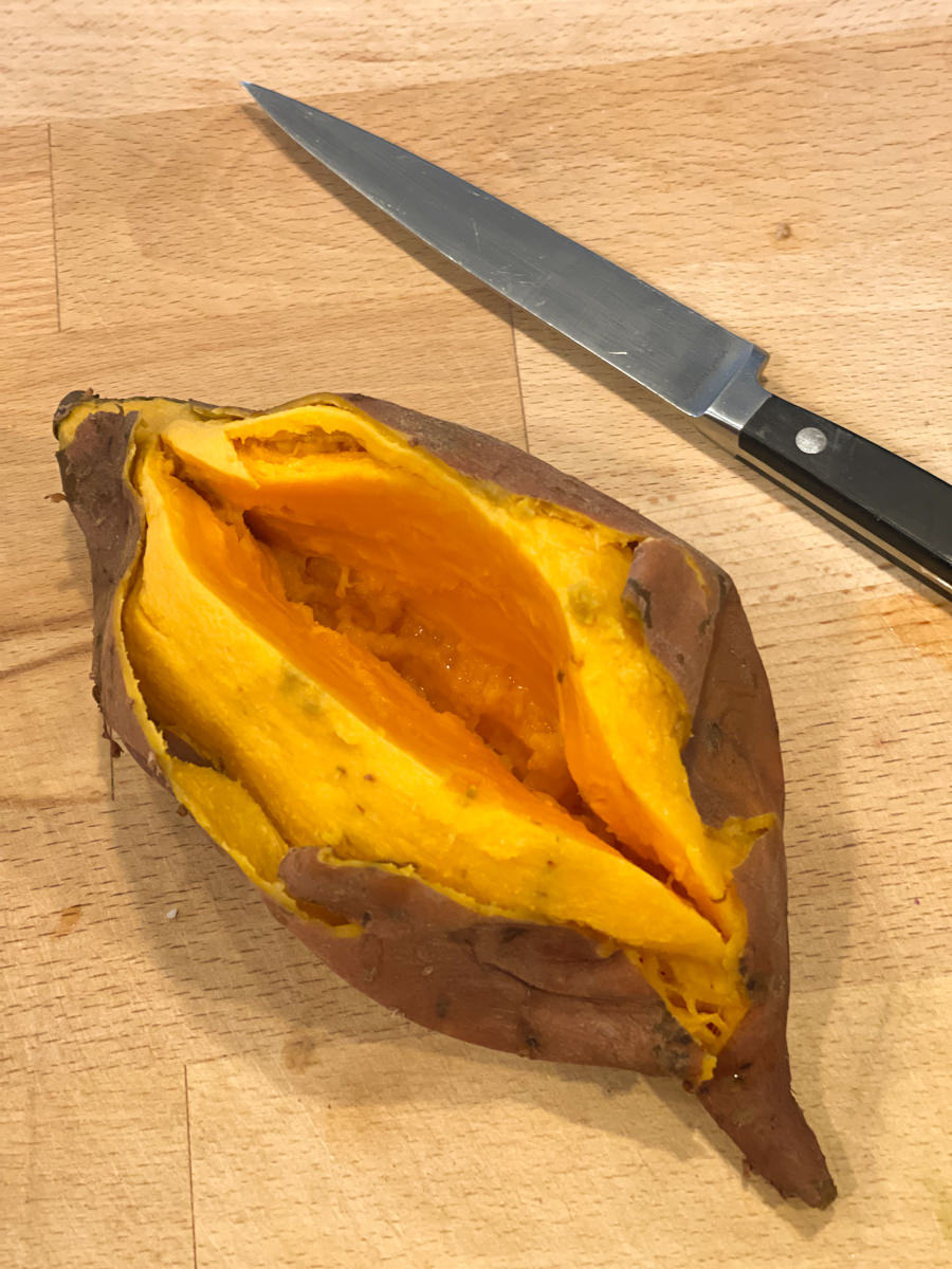 cutting open the sweet potato