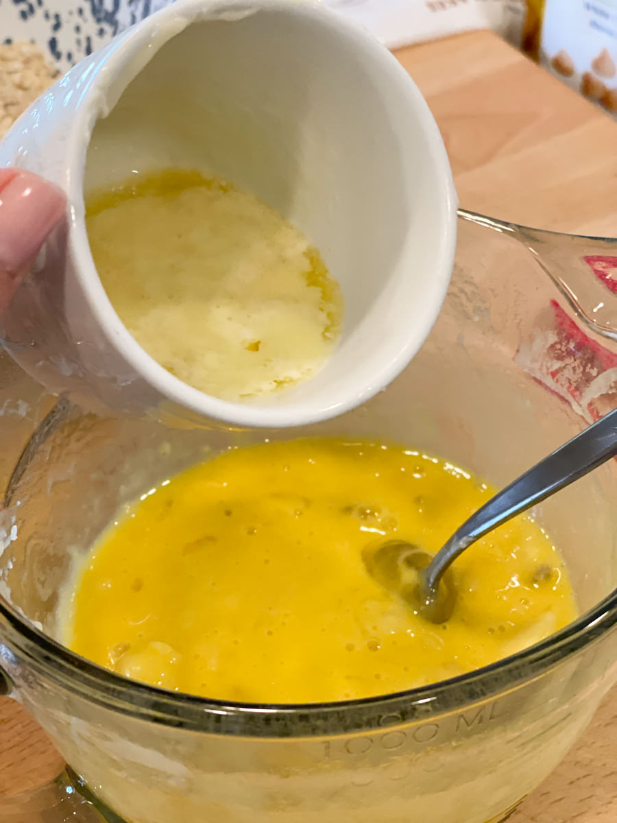 adding melted cooled butter