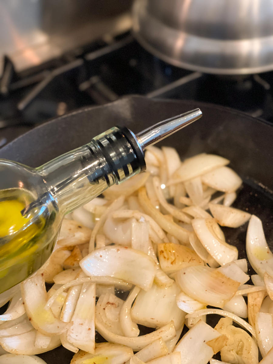 adding olive oil to caramelize onions