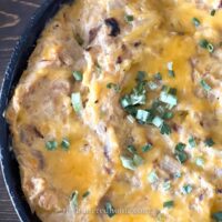 quest made with squash in a cast iron skillet with green onions