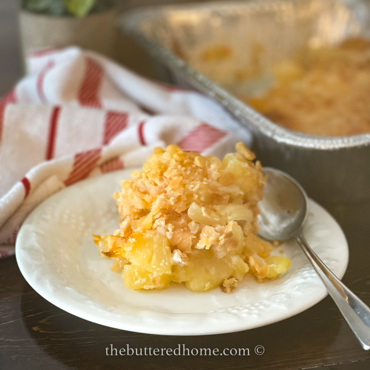 pineapple cheese casserole with a pan of it in the background