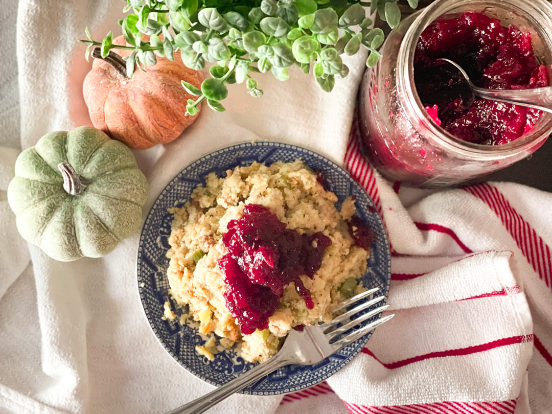 dressing and cranberry sauce with pumpkins around