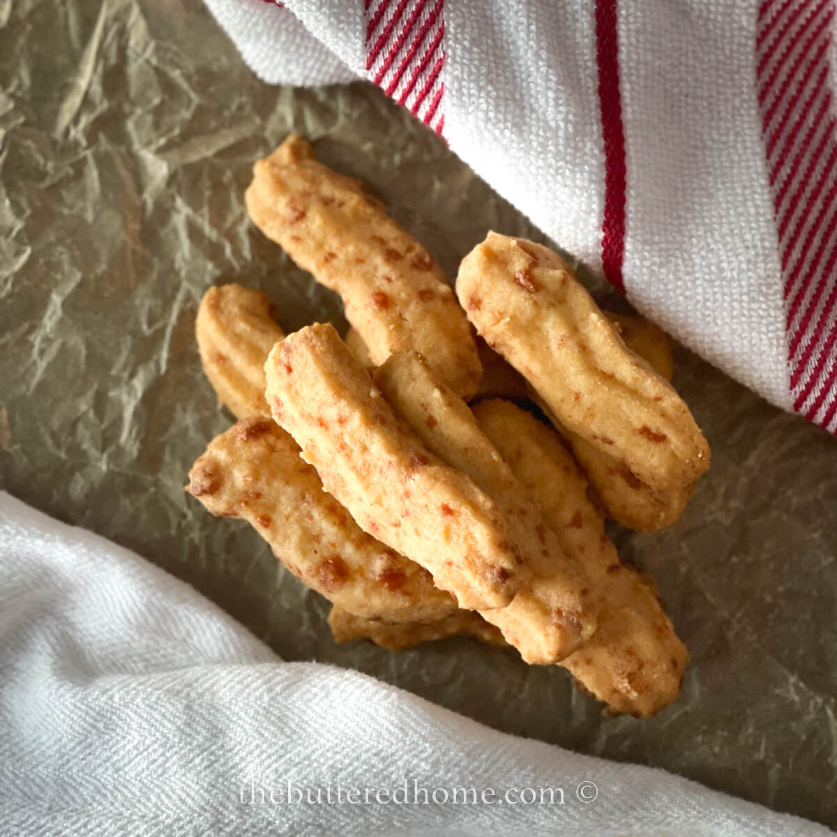 cheese straws featured on parchment