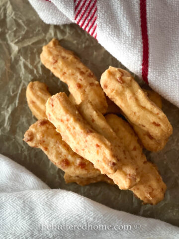 cheese straws featured on parchment
