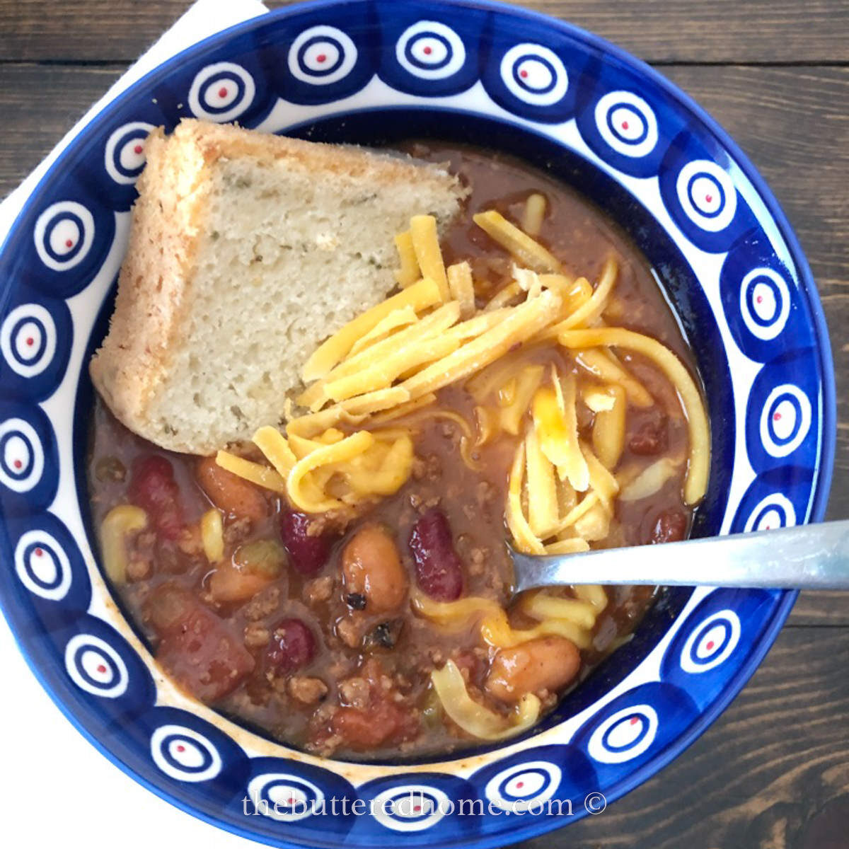 Instant Pot Chili in a blue and white bowl with bread